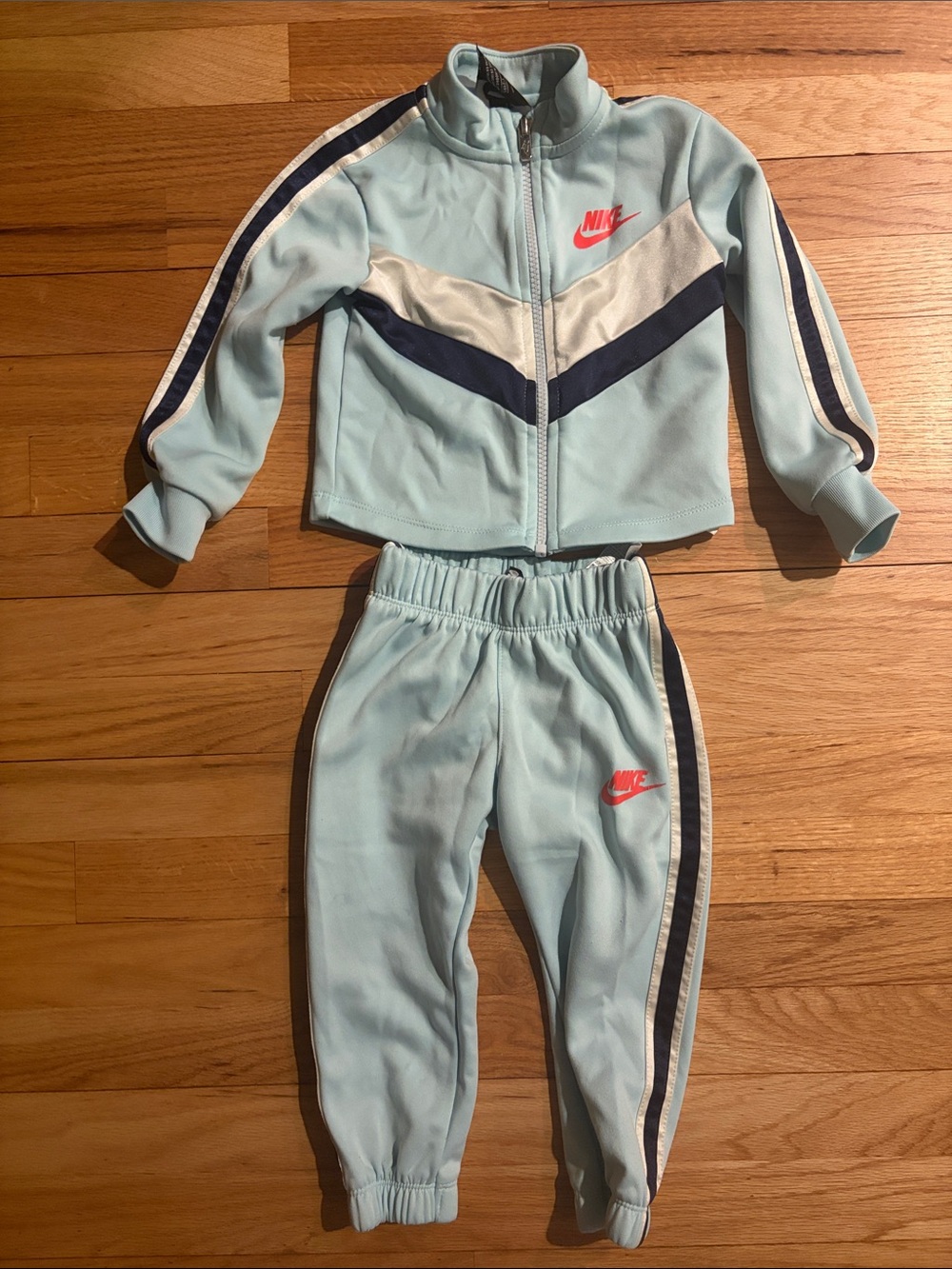 Nike Light Blue Kids Track Set with Navy Stripes and Coral Logo